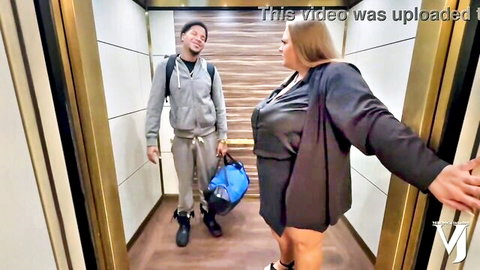 Curvy blonde BBW in tight dress teases smiling black man in elevator