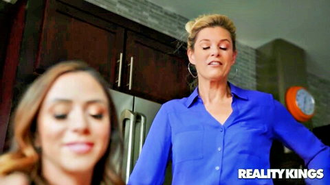 Blonde stepmom and Latina auntie tease in steamy kitchen encounter