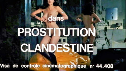 Vintage 1975 French nude brunette women posing arms outstretched in clandestine prostitution scene