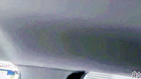 Blurry close-up of foggy metallic surface with light reflections and highlights