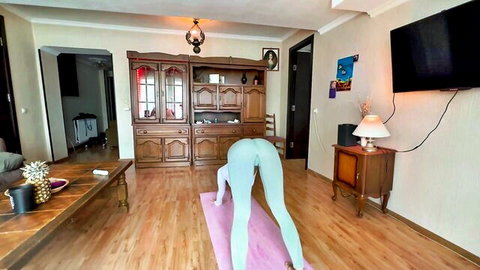 Hot babe in tight cyan yoga pants does downward dog pose showing juicy round ass