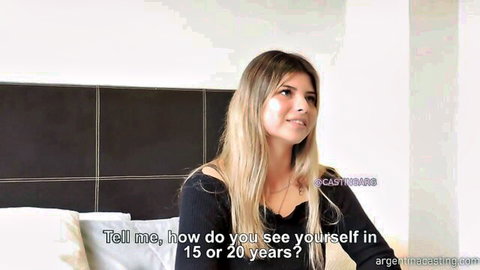 Blonde Argentine teen Agustina in casting interview, smiling on bed