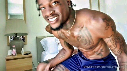 Damion Dayski muscular Black man smiling shirtless on OnlyFans