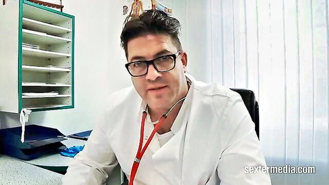 Handsome doctor in white coat and glasses, ready for erotic medical play