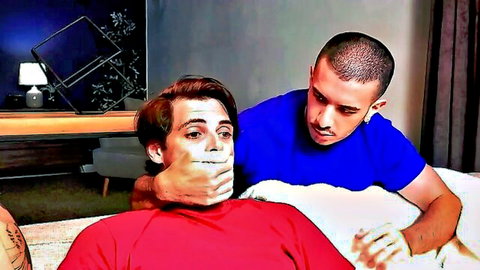 Young gay guys in rough bedroom play with taped mouth and head grab from behind