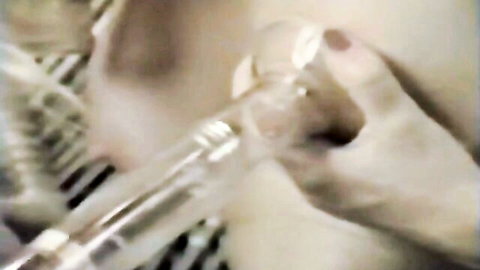 Two seductive blondes pumping each other's nipples in explicit play