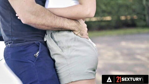 Niki Harris in sexy embrace with lover by sports car after ride