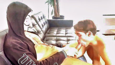 French macho in hoodie gets bareback oral from nude submissive guy on couch