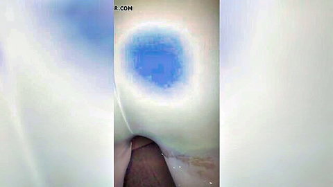 Close-up view inside pants revealing squirting pussy