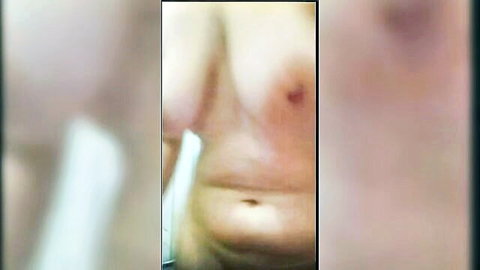 Blurry closeup of mature Turkish woman's saggy big natural tits with huge nipples and belly