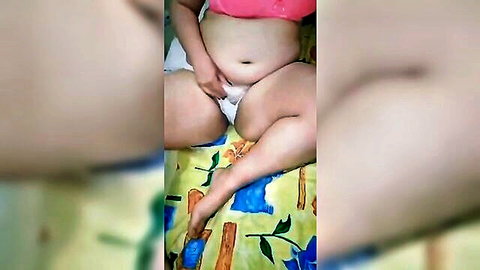 BBW mom pulls white panties aside exposing hairy pussy and fat belly on bed