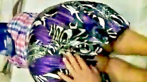 Amateur woman bent over, big ass exposed in purple shorts, hands grabbing cheeks