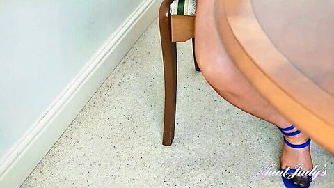 Busty blonde MILF Lady Lucy Gresty teases legs in stockings and blue heels