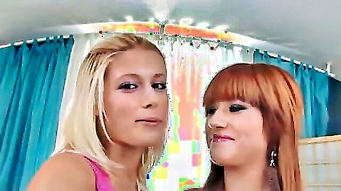 Sexy blonde and redhead lesbians posing together in colorful beaded shower room