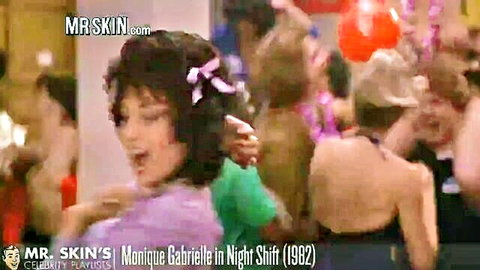 Monique Gabrielle dances seductively with open mouth at crowded wild party in Night Shift 1982