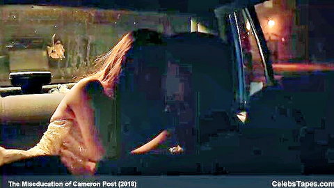 Topless redhead teen leaning nude over seat kissing girl in rainy car