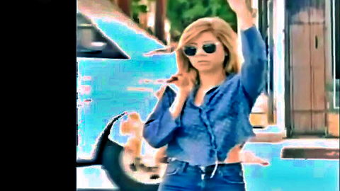 Blonde iCarly-inspired babe in cropped denim shirt and jeans hailing on street