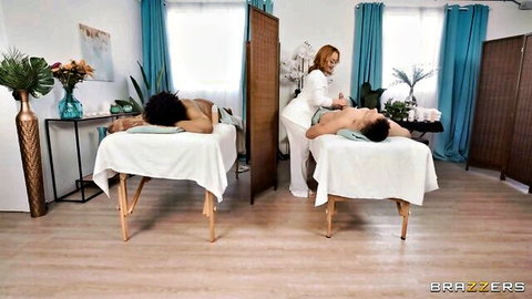 Redhead masseuse oils muscular black and Asian hunks during steamy threesome massage