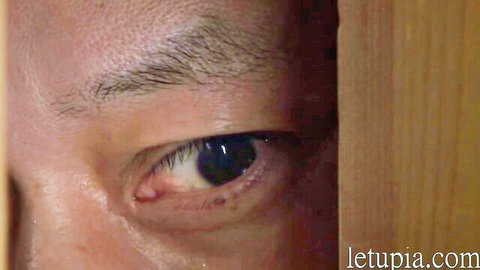 Asian woman peeking seductively through door in Tropical Night