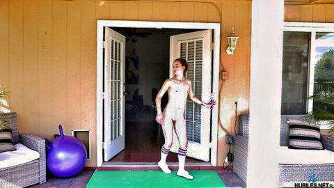 Shaved redhead Danni Rivers in erotic white body paint yoga pose