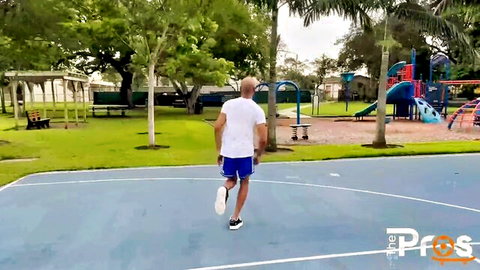 Mena Carlisle outdoor scene with athletic black man on basketball court