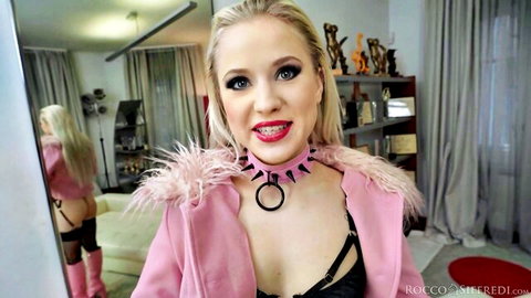 Young blonde in pink fur jacket and choker teases with small tits cleavage and mirror thong ass view