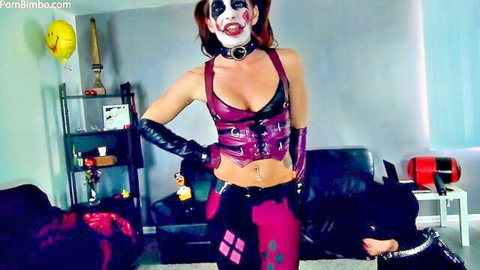 Curvy Harley Quinn cosplay babe in shiny latex corset poses dominantly with leashed black dog