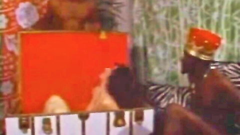 Vintage interracial treasure slave scene with crowned black king dominating nude woman