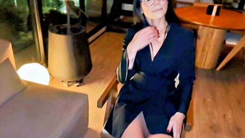 Seductive Asian therapist in black dress with glasses, POV therapy session