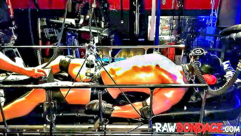 Bound male slave endures cock pumping in intense BDSM scene