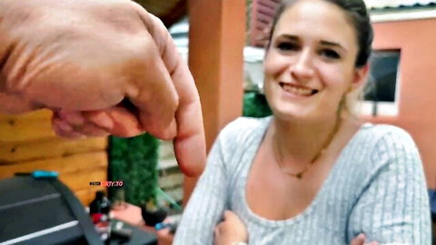 Melina May smiling seductively outdoors, ready for blowjob tease