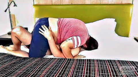 Amateur couple fucking doggy style on bed as man thrusts into woman from behind