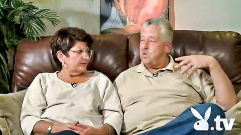 Mature glasses brunette with big tits sits intimately with husband on couch for amateur sex