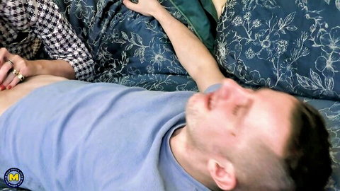 Mature blonde gets nylon legs worshipped by younger guy on bed