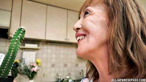 Asano Taeko smiles holding cactus as naughty Japanese housewife
