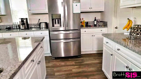 Empty Bratty Sis kitchen with white cabinets, granite counters, fridge and bananas for taboo stepsister fuck