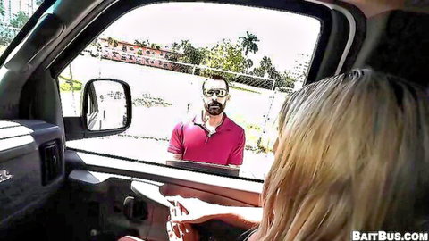 Blonde babe in van window flirts with handsome bearded guy in pink polo shirt