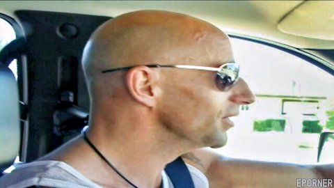 Bald muscular man in sunglasses and tank top in car, teasing for titjob action
