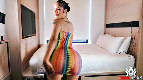 Mami Giany in rainbow dress showing off curves