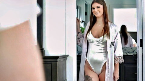 Sky Wonderland in sexy silver robe and bodysuit, smiling seductively