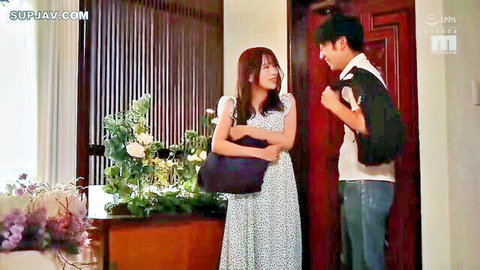 Japanese woman in floral dress chats with casual man at door in JAV
