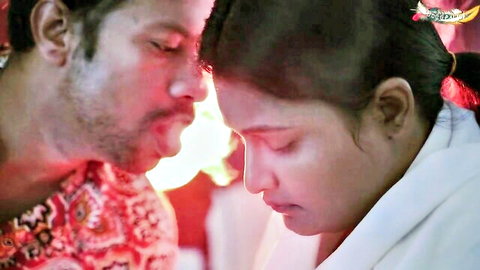 Intimate close-up of Desi widow and stepbrother in traditional Indian attire