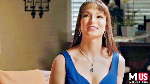 Seductive brunette smiling with deep cleavage in tight blue top