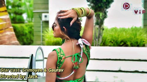 Desi beauty in sexy backless green blouse, long braided hair, seductive outdoor pose