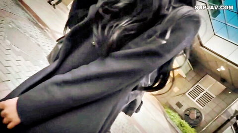 Asian MILF in long black coat walking outdoors, JAV style