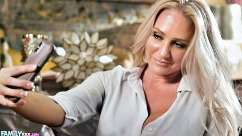 Blonde MILF Alexis Malone taking sexy selfie in open white blouse