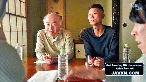 Beautiful Asian housewife sitting with two men in JAV gangbang setup