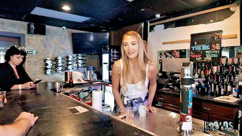 Blonde bartender leaning over bar showing deep cleavage tits in public pickup bar scene