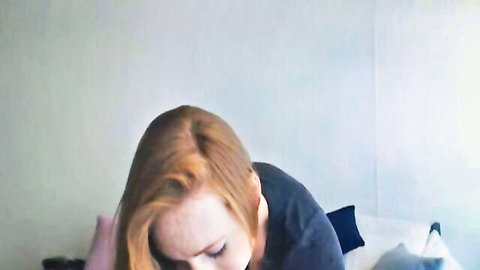 Amateur redhead teen in dark top, head down in solo masturbation scene