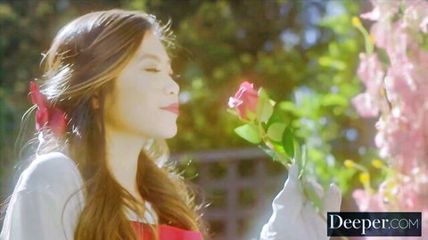 Vina Sky in elegant red dress smelling rose, seductive garden pose Deeper.com